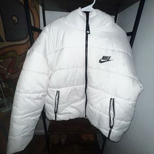 White Nike puffer coat.